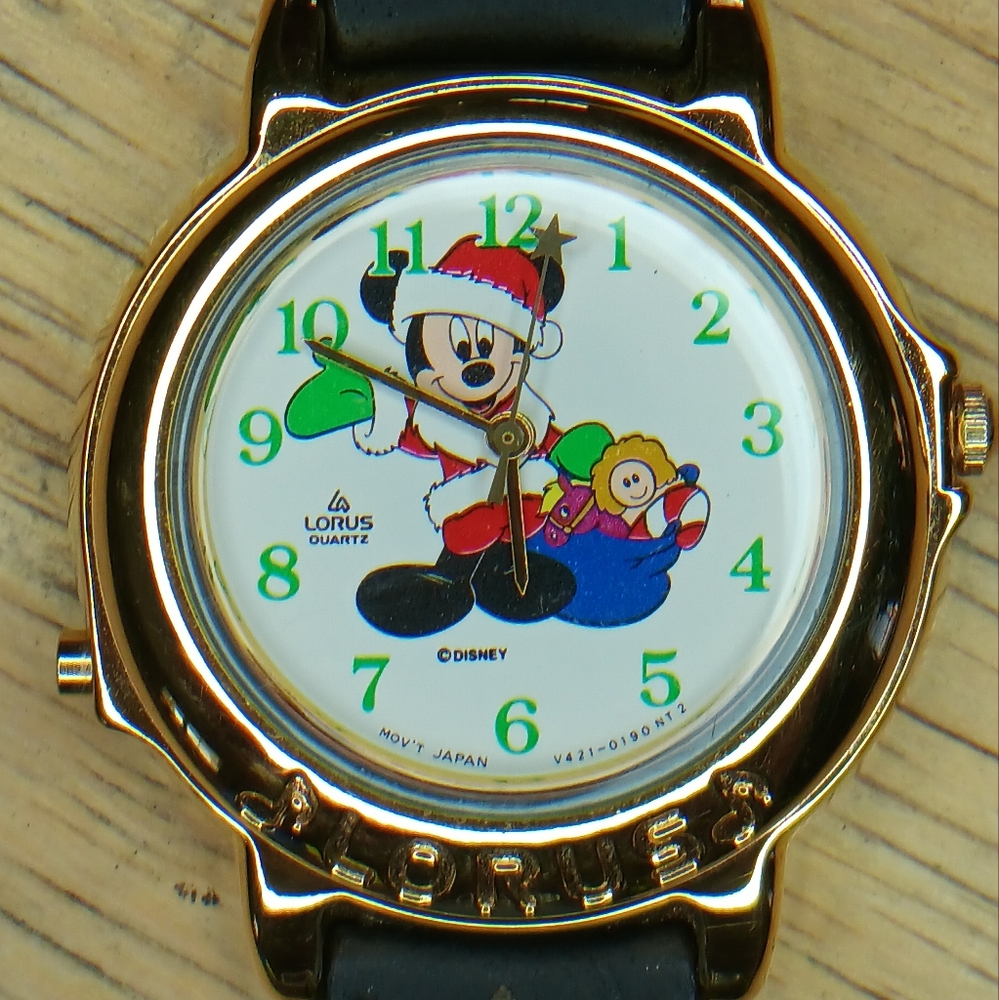 X Lorus Mickey Mouse Christmas musical watch gold tone case, black leather